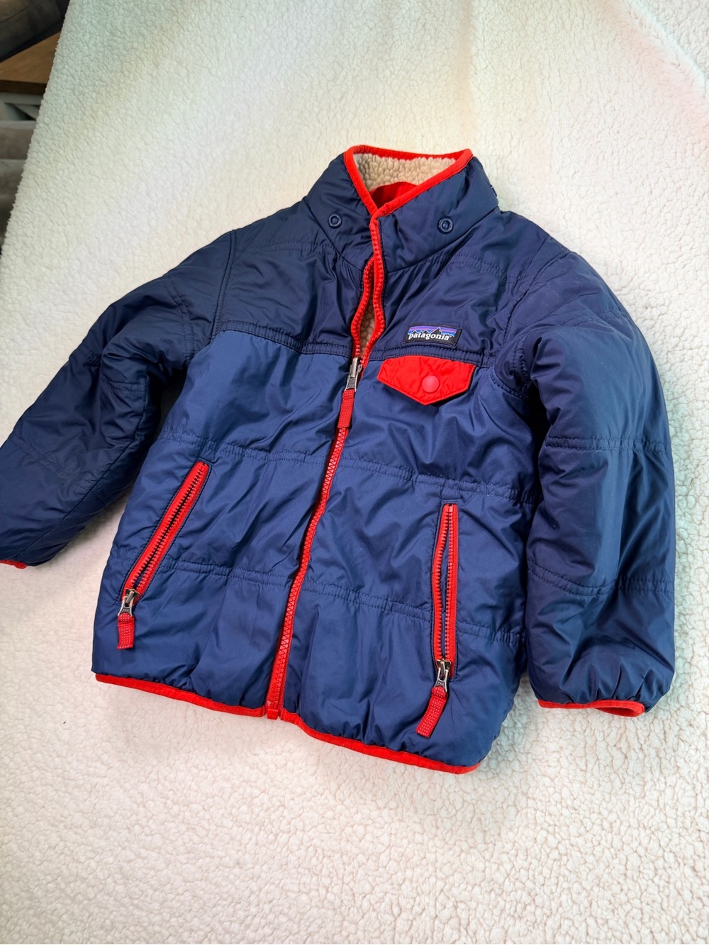 Patagonia Kids Navy Puffer Jacket with Red Trim Accents